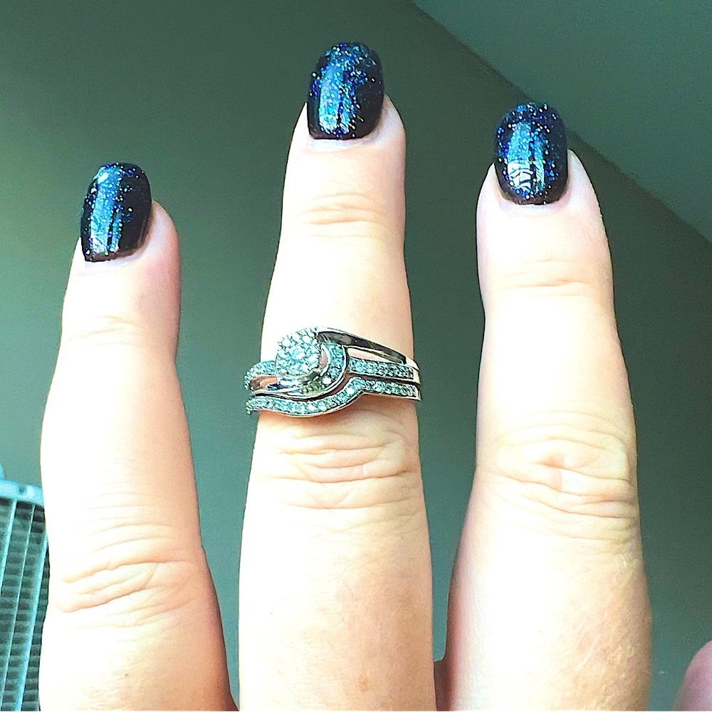 Solid white gold wedding set with several diamonds